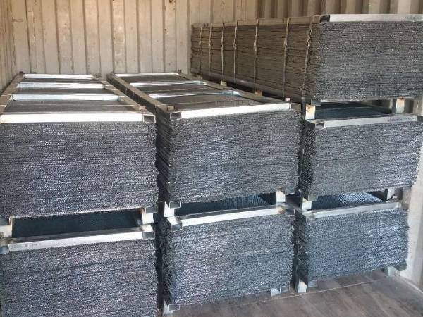 Packed expanded metal lath is loaded onto the compartment for shipping